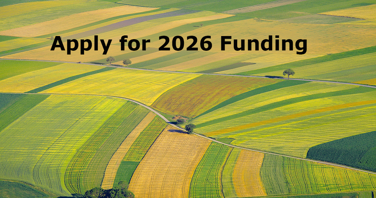 Apply for 2026 funding with a background of an aerial view of corn fields
